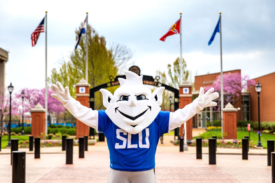 The Billiken in front of the the gate in front of BSC