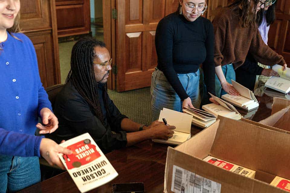 Author Colson Whitehead signs copies of his book, The Underground Railroad, at a SLU event.